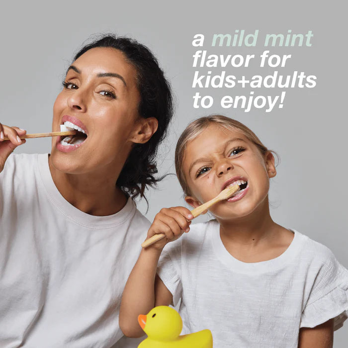 Woman and child brushing their teeth together with a yellow rubber duck, promoting a mild mint flavor David's toothpaste.