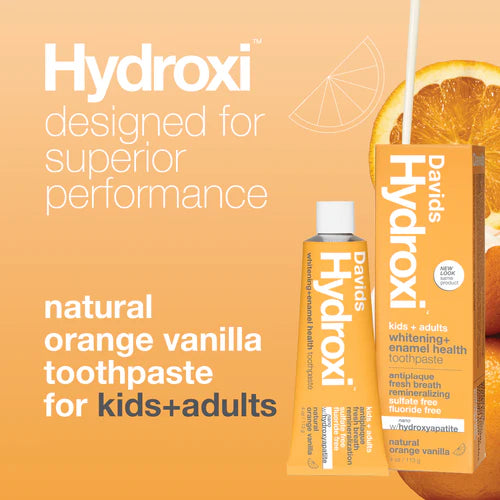 DAvids Hydroxi toothpaste and packaging on an orange background with text about superior performance and natural flavors.