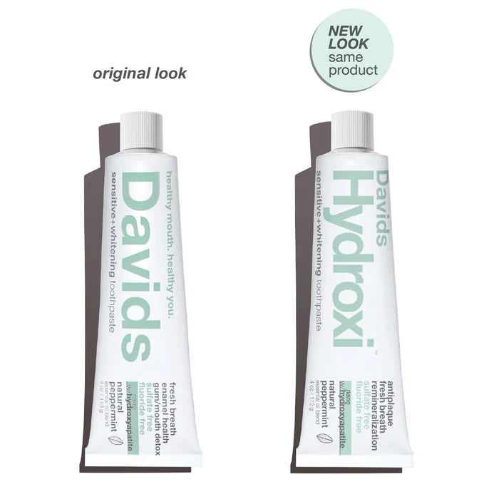Two toothpaste tubes labeled 'Davids' and 'Hydroxi' with text indicating a new look for the same product.