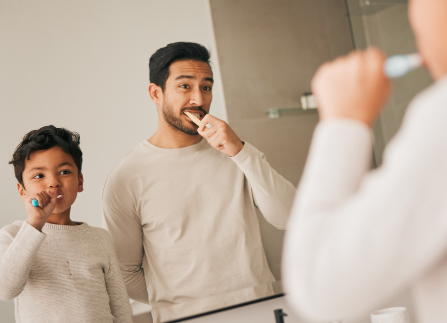 Boy and Dad Brushing Teeth