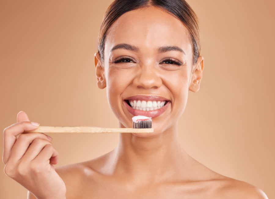 Woman with wide smile ready to brush her teeth