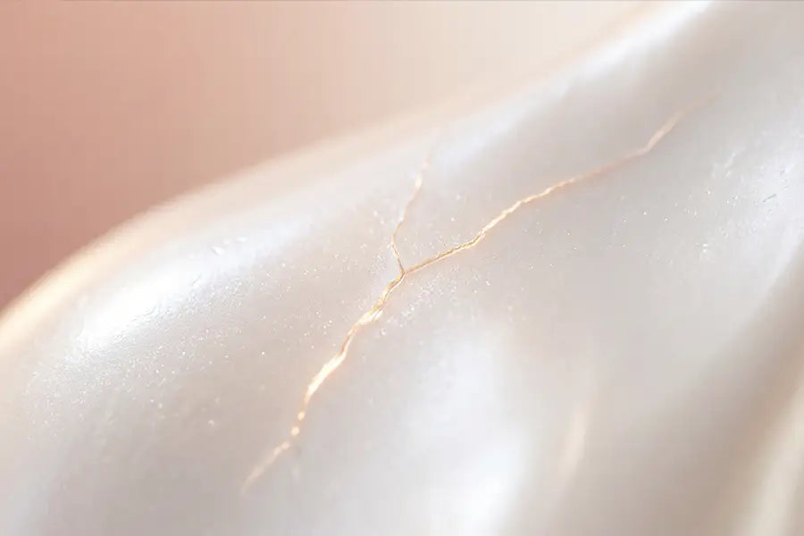 Macro of pearlescent surface with fine crack representing weakened tooth enamel