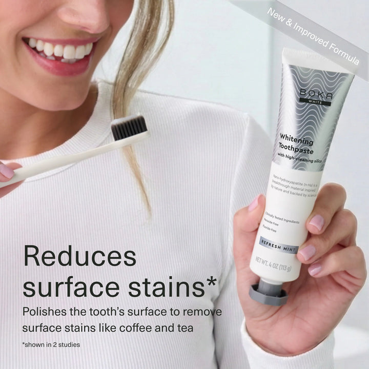 Woman holding Boka Refresh Mint whitening toothpaste — polishes away surface stains like coffee and tea