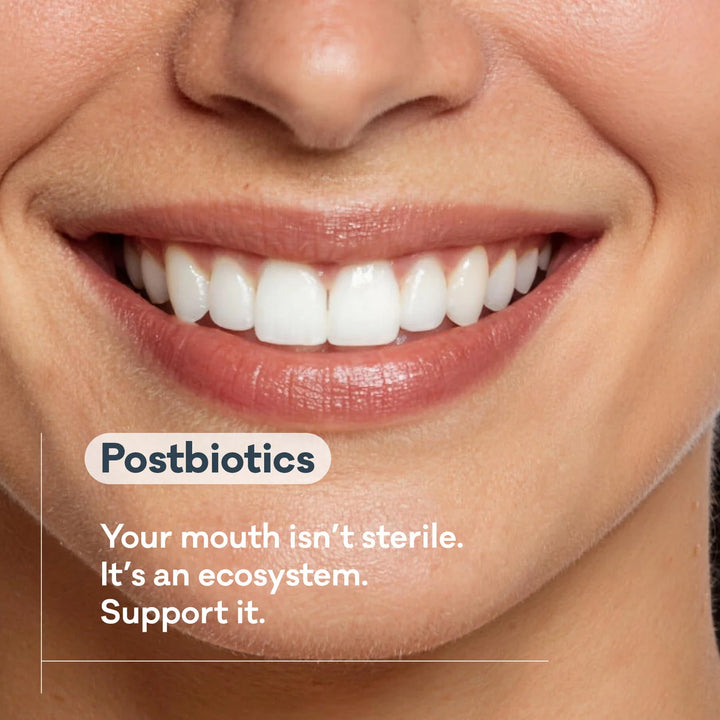 Close-up of a smile with a Grin Pro postbiotics callout — brand graphic about the mouth as an ecosystem