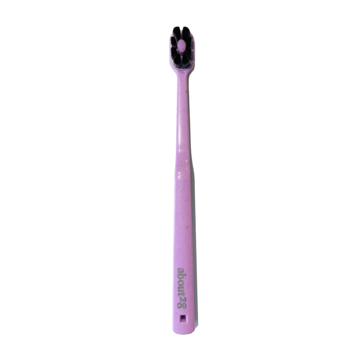Lavender toothbrush with black bristle head on a white background