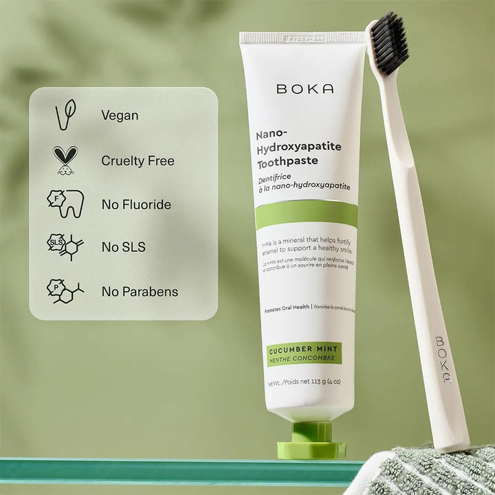 Boka Cucumber Mint toothpaste and a Boka toothbrush beside a card listing vegan, cruelty free, no fluoride, no SLS and no parabens