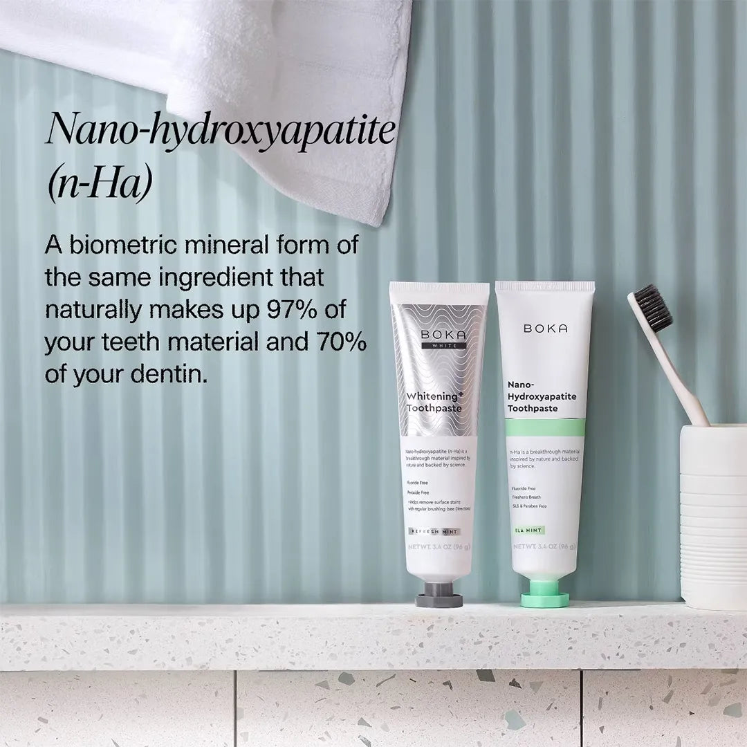 Boka Whitening and Ela Mint toothpaste tubes on a bathroom shelf with nano-hydroxyapatite (n-Ha) explainer