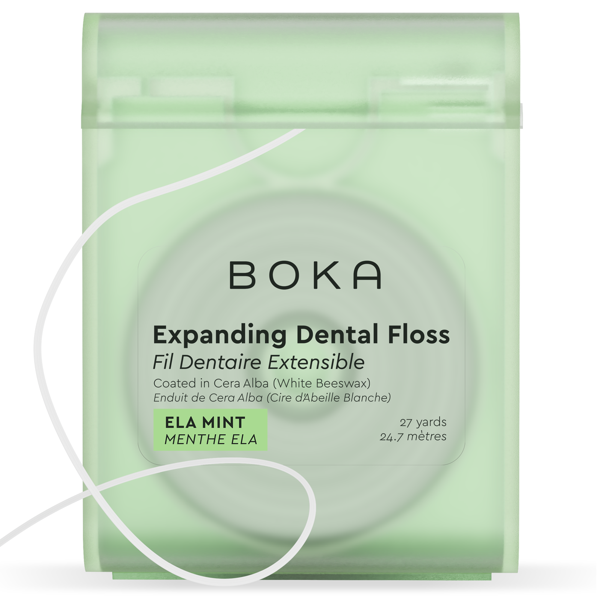 Front of the translucent green Boka Expanding Dental Floss dispenser in Ela Mint with a loose strand of white floss