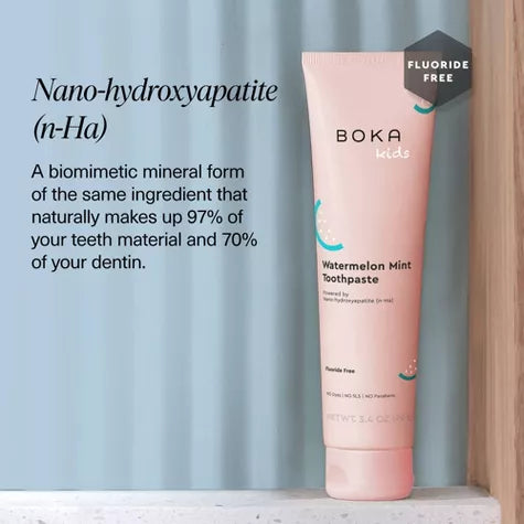 Boka Kids watermelon mint toothpaste tube with text about nano-hydroxyapatite on a light blue background.