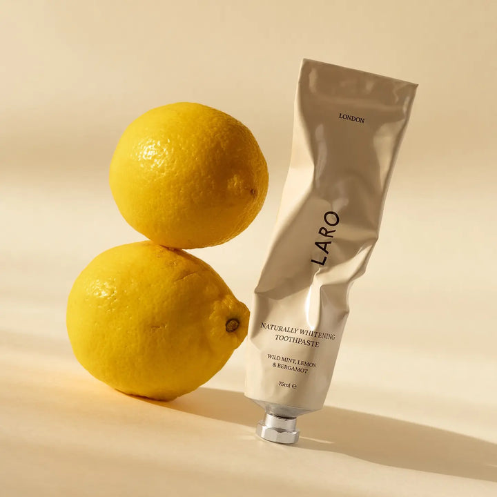 LARO toothpaste tube with two lemons on a beige background