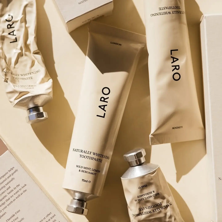 Laro toothpaste and products on a beige background