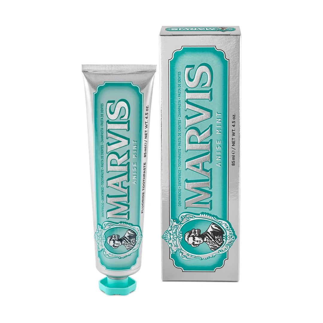 Silver and aqua Marvis Anise Mint toothpaste tube, 85ml, with an aqua cap, standing next to its matching carton on a white background