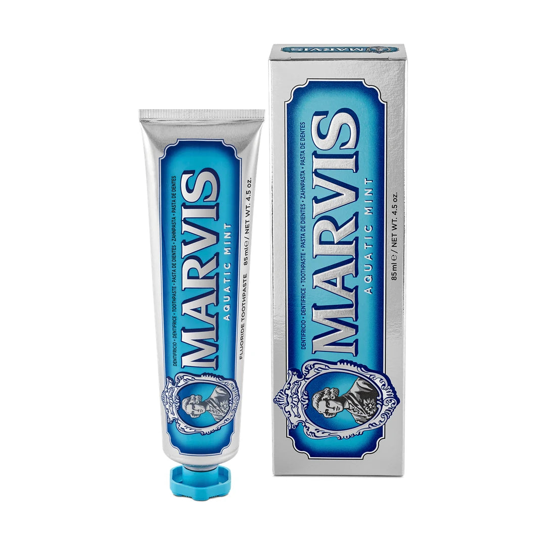 Marvis Aquatic Mint toothpaste 85ml, silver tube with an aqua blue label and turquoise cap beside its silver and blue carton