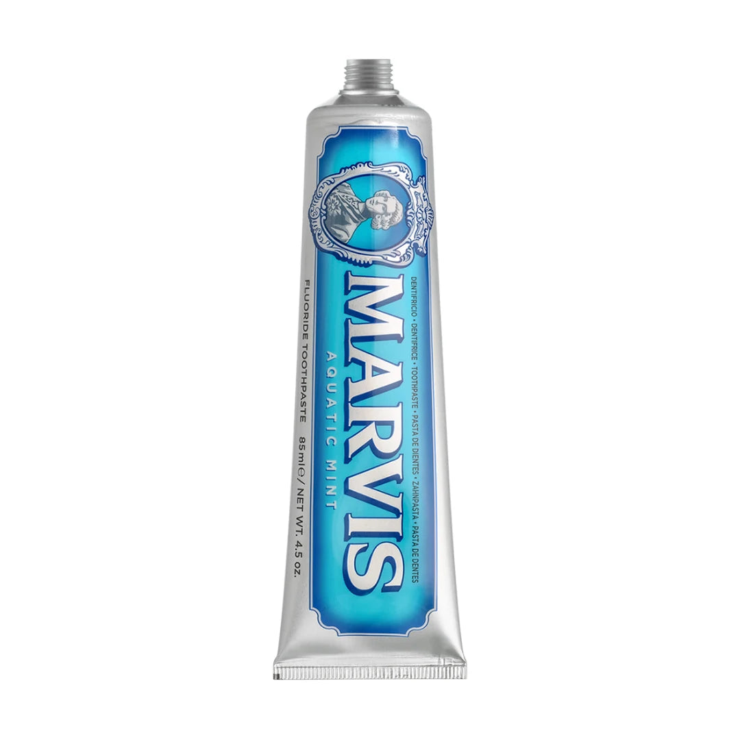 Marvis Aquatic Mint 85ml toothpaste tube shown upright without its cap, silver with an aqua blue label and cameo portrait