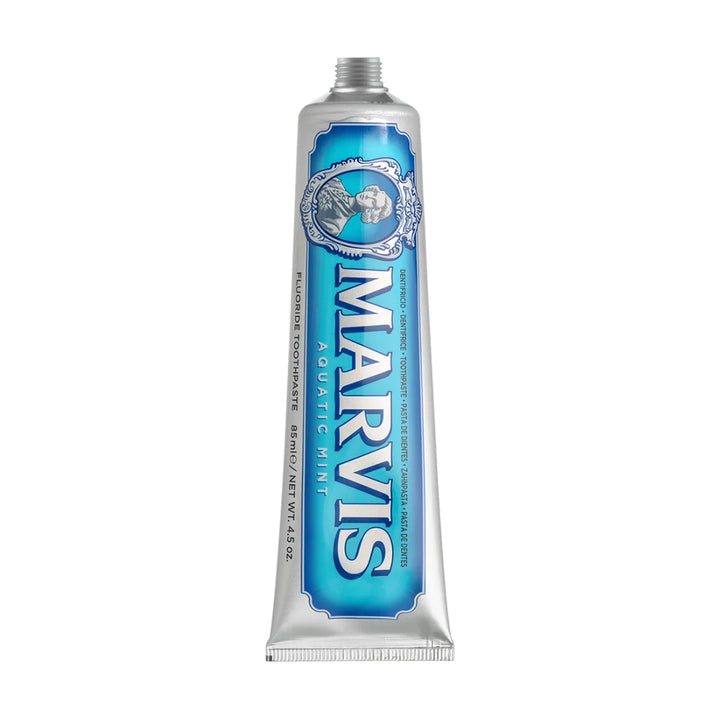 Marvis Aquatic Mint 85ml toothpaste tube shown upright without its cap, silver with an aqua blue label and cameo portrait