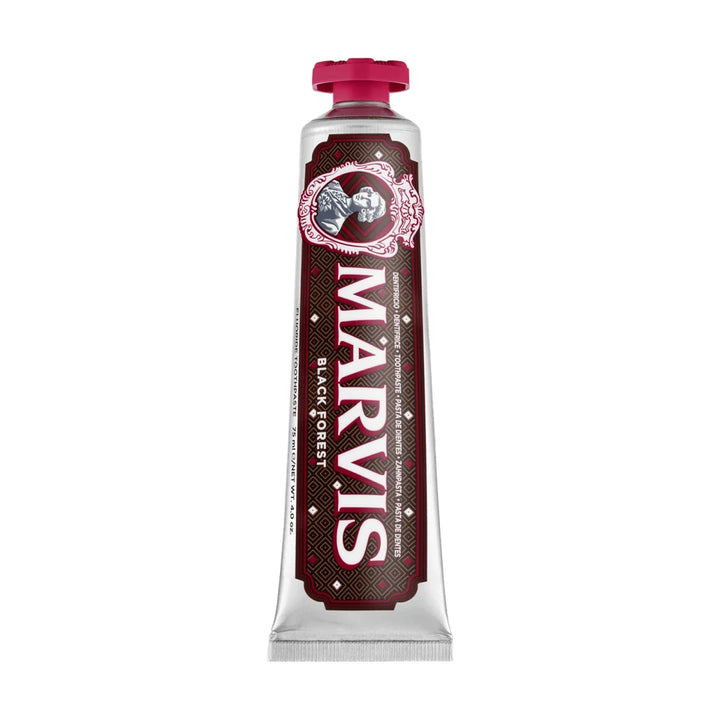 Marvis Black Forest 75ml tube standing cap up, silver with a dark brown diamond pattern label, a cameo portrait and a crimson cap