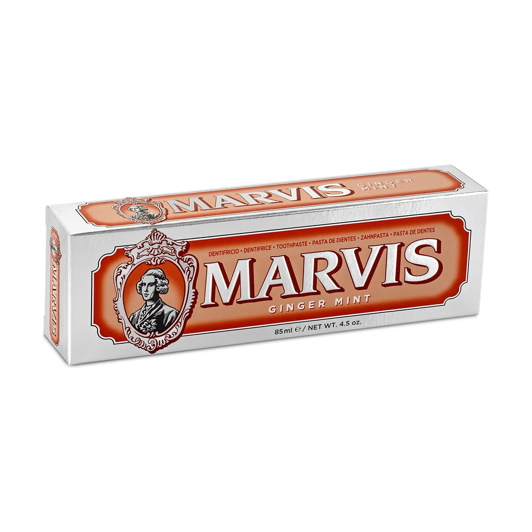 Marvis Ginger Mint 85ml toothpaste carton in silver with an orange panel and cameo portrait, shown at an angle on white