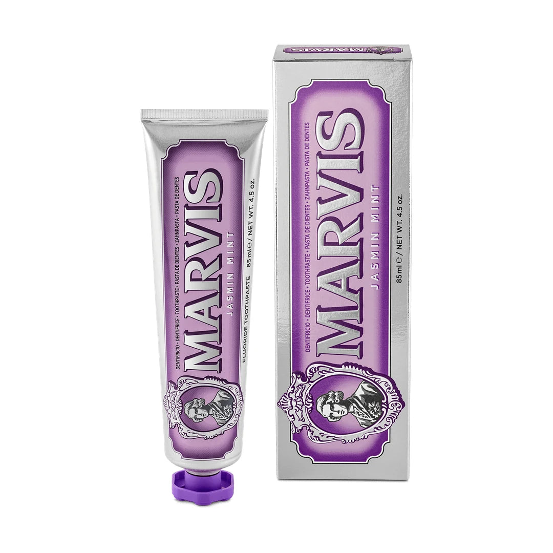 Marvis Jasmin Mint 85ml, a jasmine and mint toothpaste, in a silver tube with a violet label and cap beside its silver carton