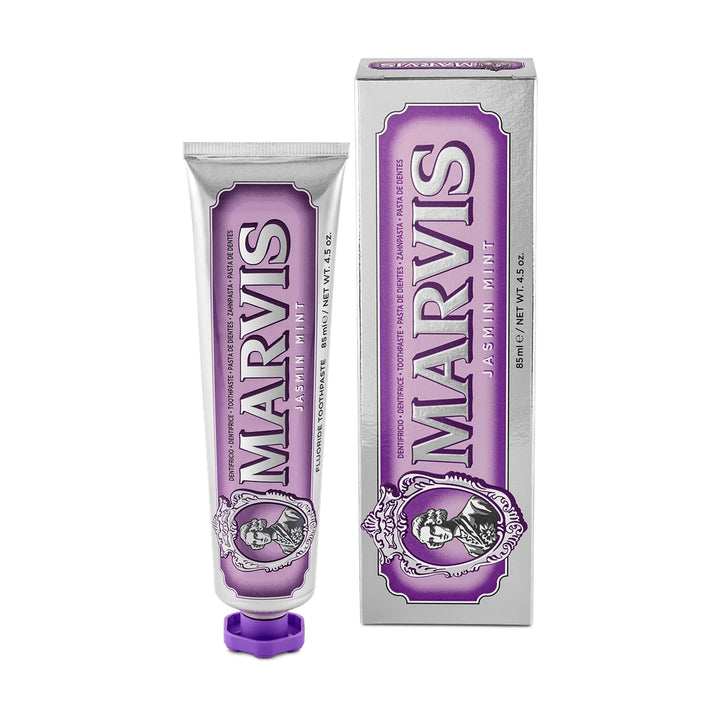Marvis Jasmin Mint 85ml, a jasmine and mint toothpaste, in a silver tube with a violet label and cap beside its silver carton