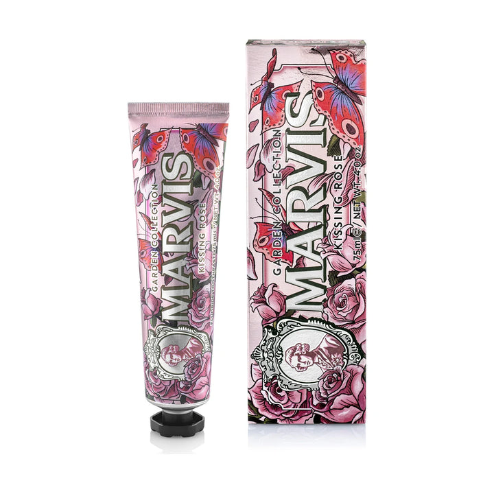 Marvis Kissing Rose toothpaste 75ml in a pink tube with a black cap beside its matching carton, printed with roses and butterflies