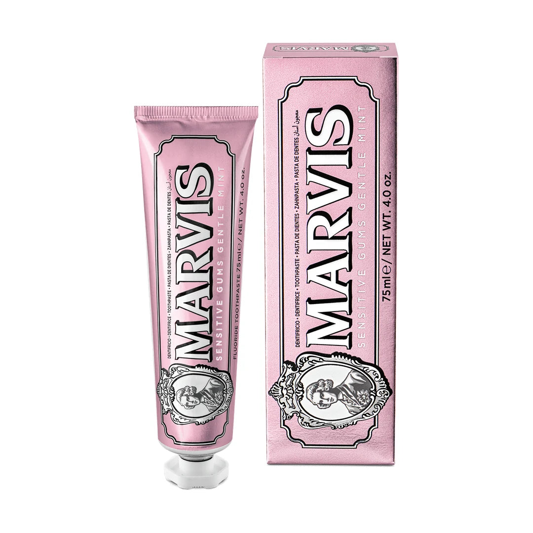 Marvis Sensitive Gums 75ml toothpaste, pink with a white cap and portrait cameo, upright beside its carton on a white background