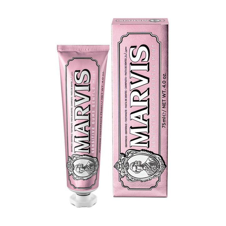 Marvis Sensitive Gums 75ml toothpaste, pink with a white cap and portrait cameo, upright beside its carton on a white background
