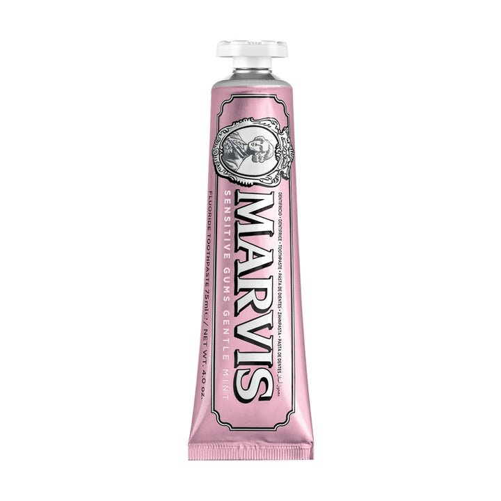 Pink Marvis Sensitive Gums 75ml toothpaste tube standing cap up, with white Marvis lettering outlined in black and a portrait cameo