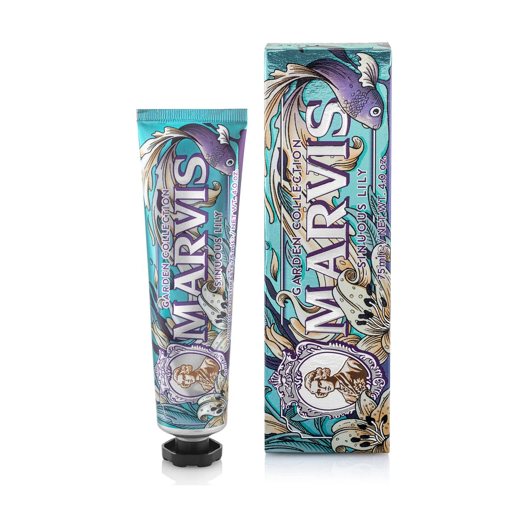 Marvis Sinuous Lily toothpaste 75ml next to its carton, a teal tube and box printed with a violet fish and cream lilies, on white