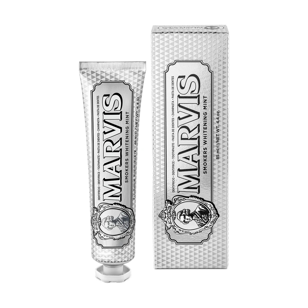 Marvis Smokers Whitening Mint toothpaste, an 85ml diamond-patterned silver tube with a white cap, beside its matching silver carton