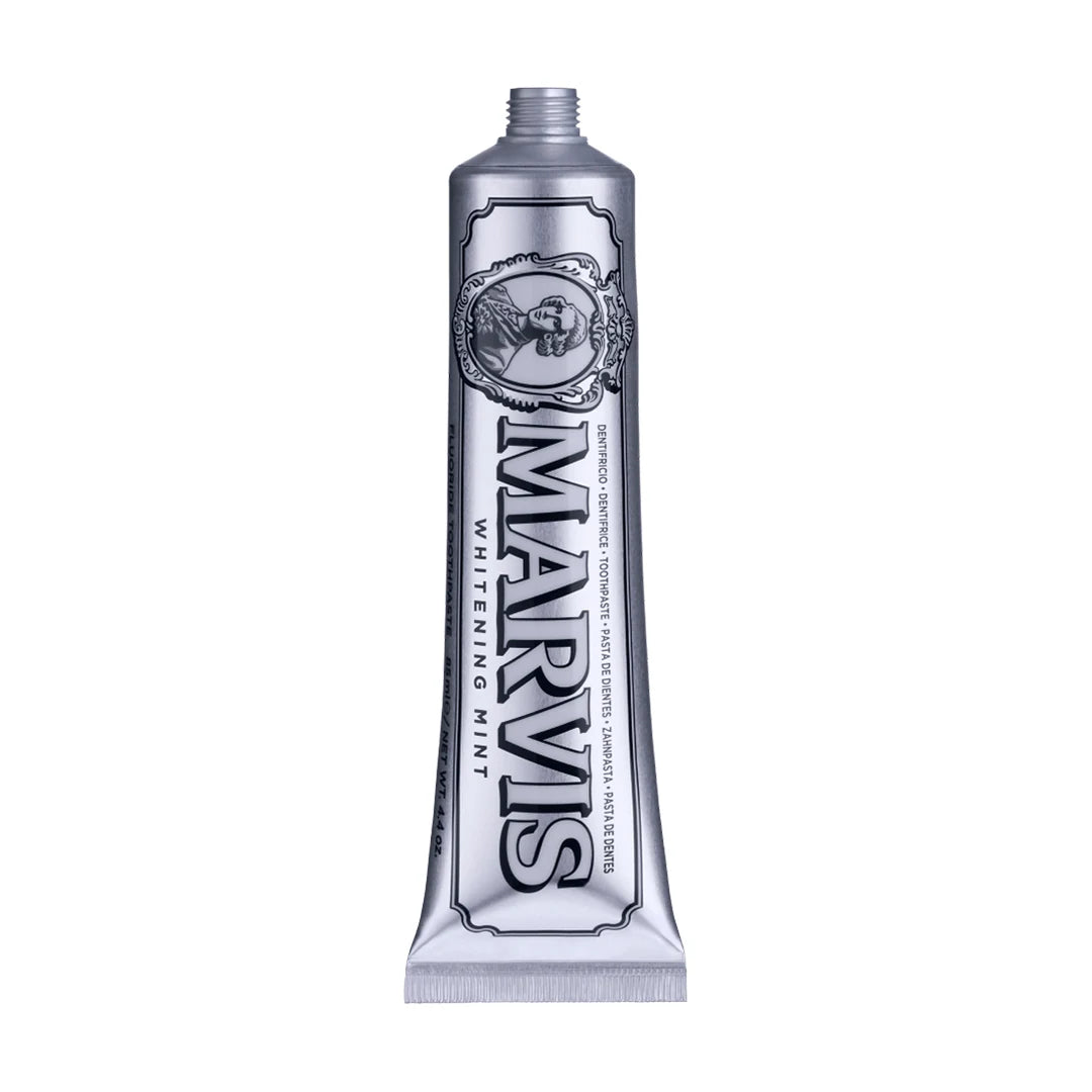 Uncapped silver Marvis Whitening Mint 85ml toothpaste tube showing the oval Marquis portrait and outlined black Marvis lettering