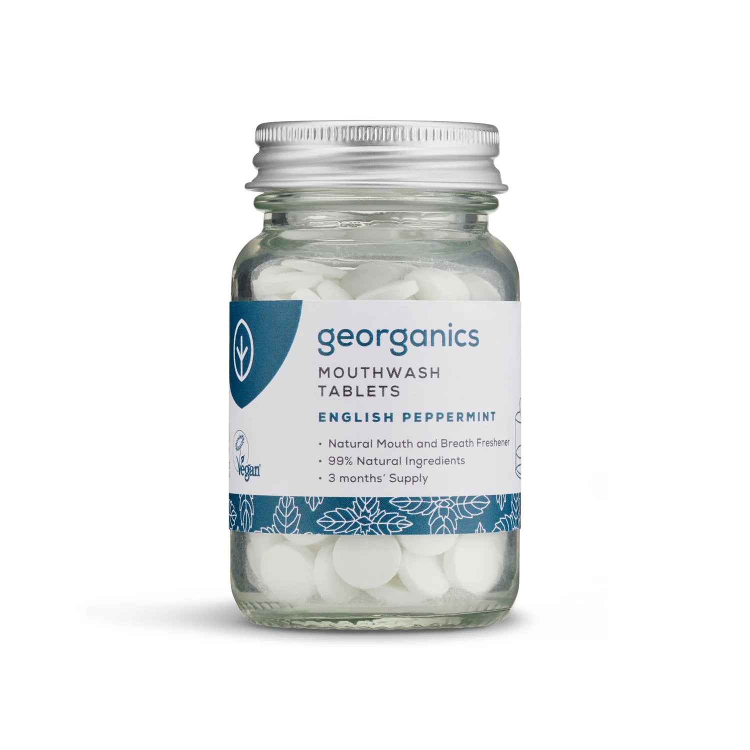 A glass jar of Georganics English Peppermint Mouthwash Tablets with a white and blue label and a silver metal cap, shown on a white background.