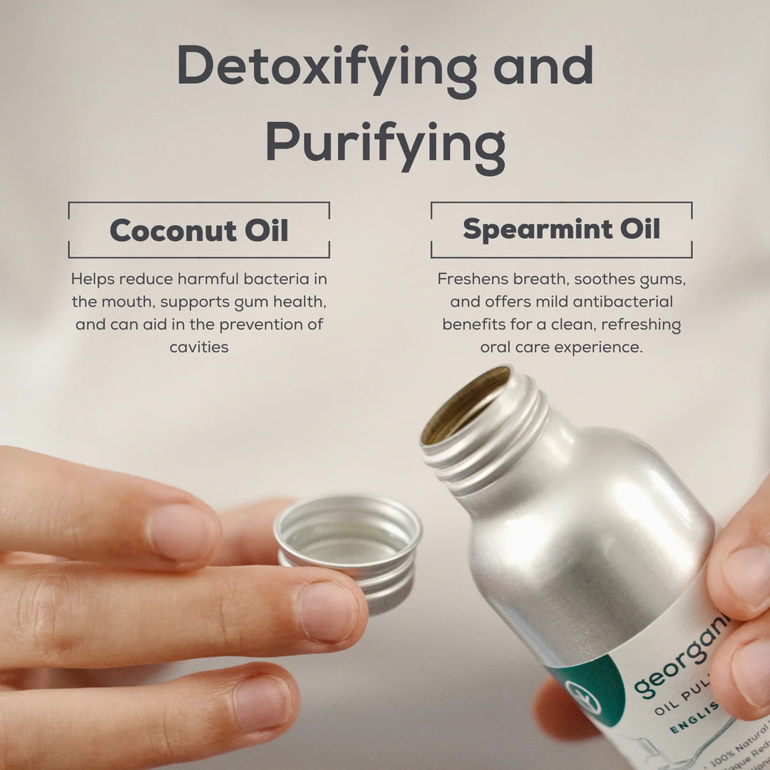 Hands opening a Georganics oil pulling mouthwash bottle, with notes on how coconut oil and spearmint oil detoxify and purify the mouth.