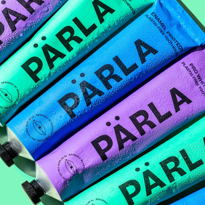 PÄRLA toothpaste range — Bio Balance, Enamel Protect and Pro Whitening aluminium tubes side by side