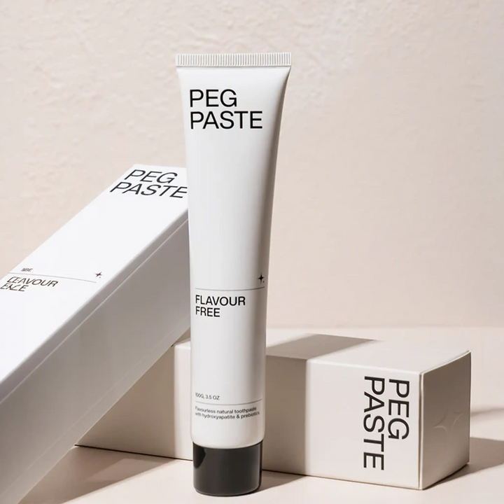 Tube of Peg Paste Flavour Free Toothpaste with packaging on a light background