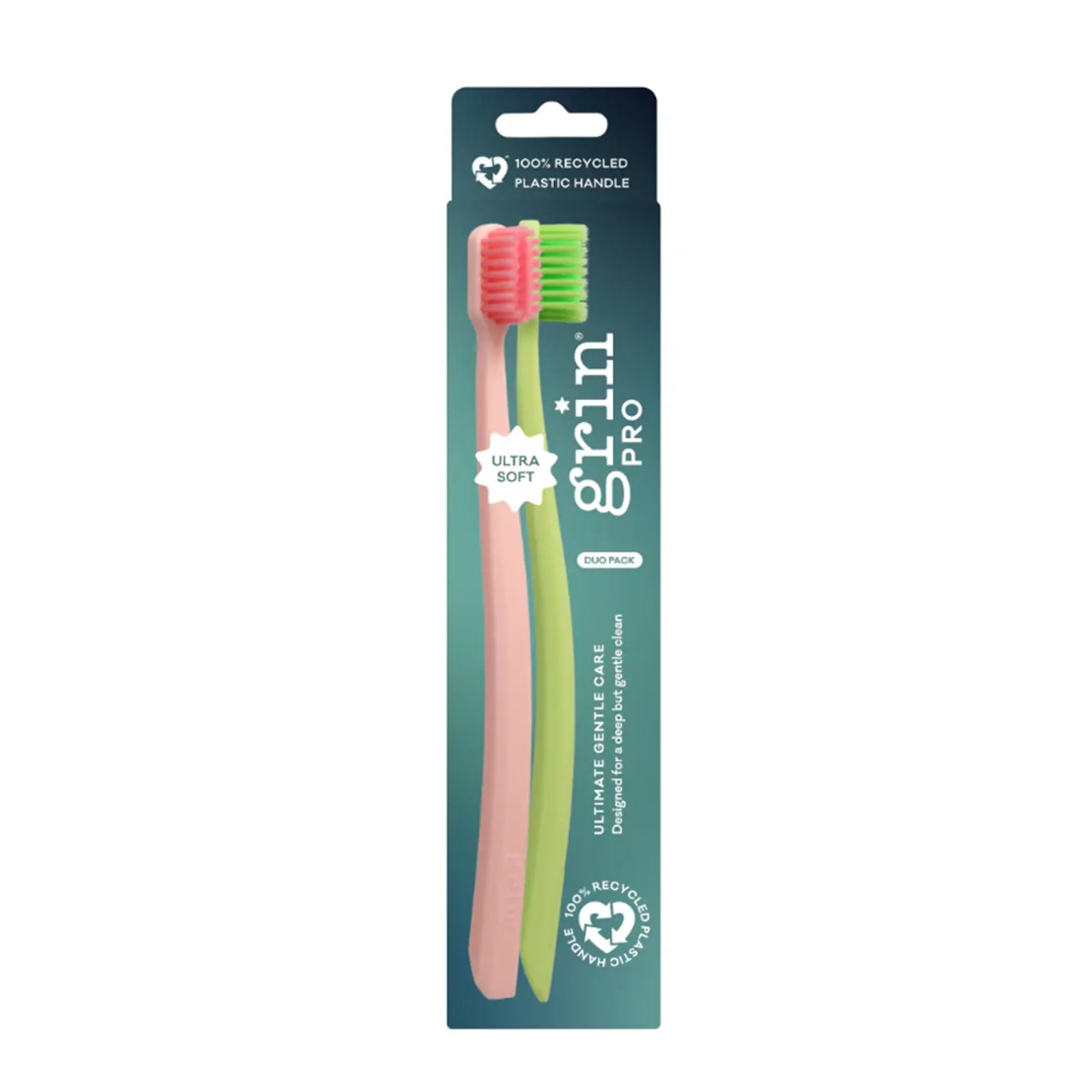 Grin Pro toothbrush with pink bristles and green handle in packaging on a white background